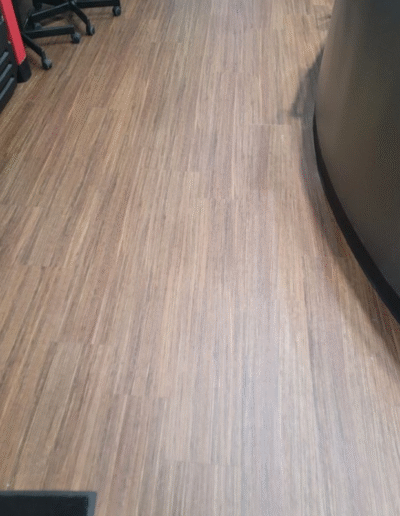 Durable Luxury Vinyl Tile (LVT) flooring in a high-traffic entryway, showcasing seamless transitions and low-maintenance design for facilities.
