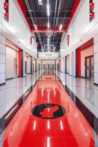 Branded athletic flooring with integrated logos and team colors