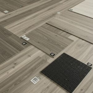 A variety of cost-effective commercial flooring materials showcased in a modern business setting