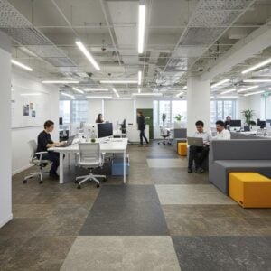 Modern office flooring options including carpet tiles and luxury vinyl in a collaborative workspace